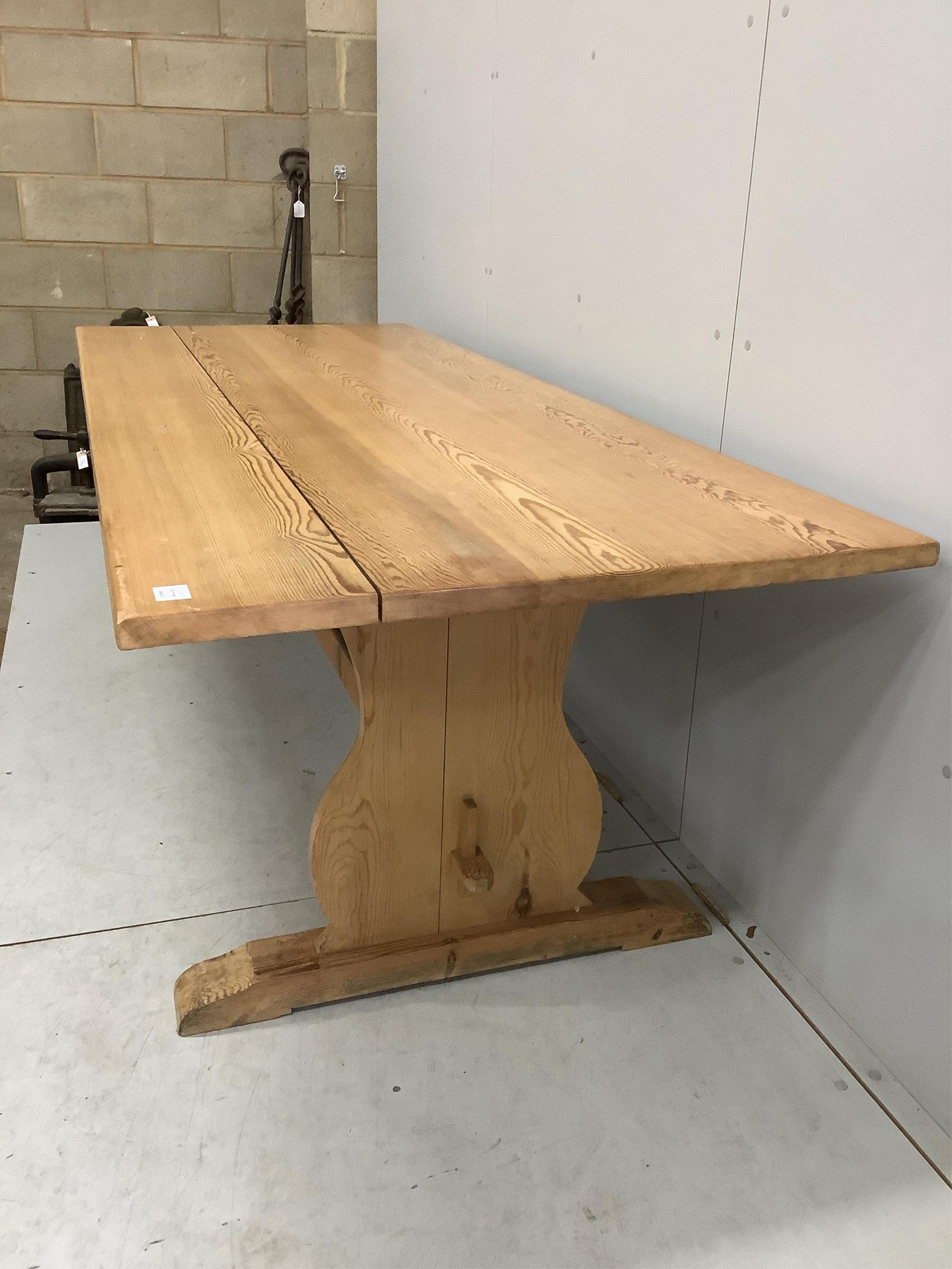 A modern rectangular pine refectory dining table, width 229cm, depth 90cm, height 73cm, together with a pine bench. Condition - fair